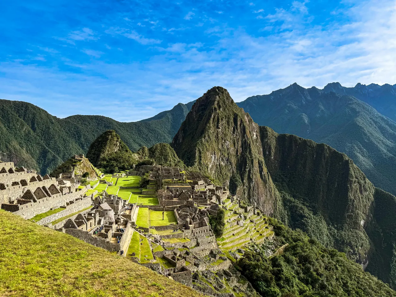 Aerial view of Machu Picchu at dawn, ancient Inca citadel shrouded in Andean mist, Peru